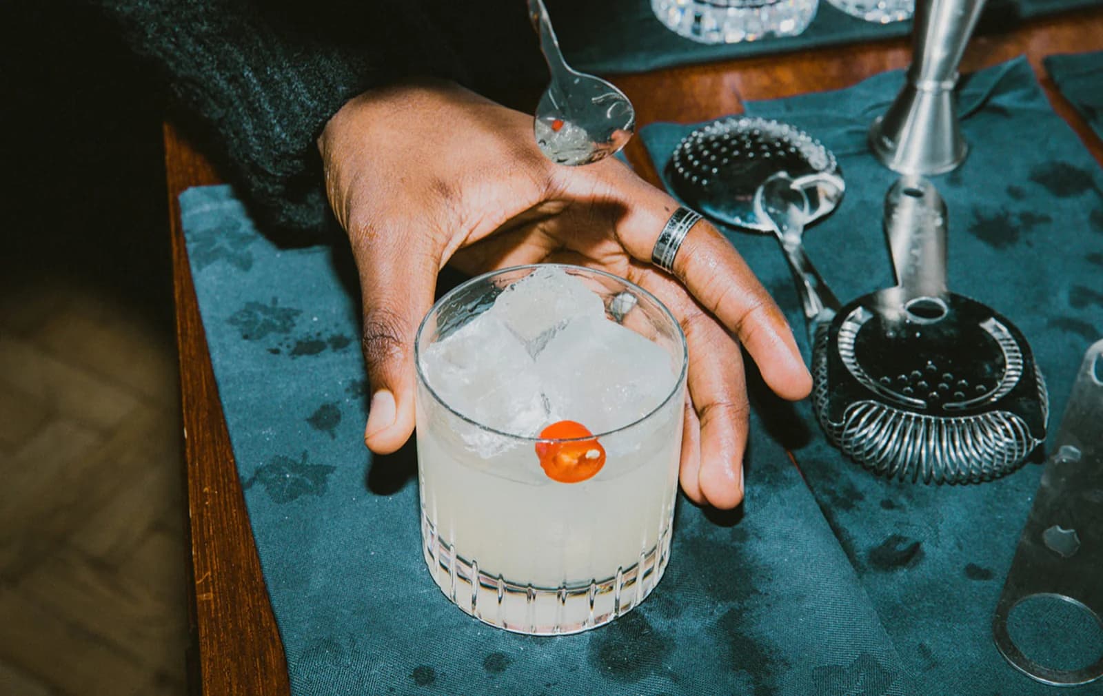 An image of a picante cocktail on the surface of a wooden Soho House bar.